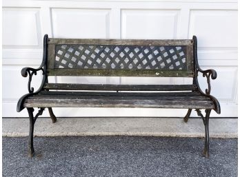 A Cast Iron And Oak Outdoor Bench