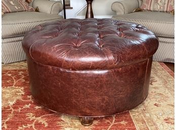 A Tufted Ottoman In Oxblood Leather