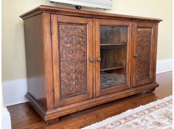 A Hardwood Bar Or Entertainment Unit With Embossed Leather Paneled Doors