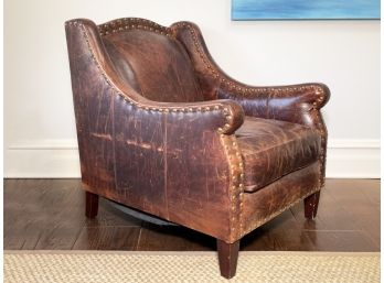 A Leather Chair With Brass Nailhead Trim By Restoration Hardware