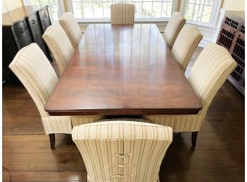 A Large Solid Mahogany Dining Table And Set Of Chairs