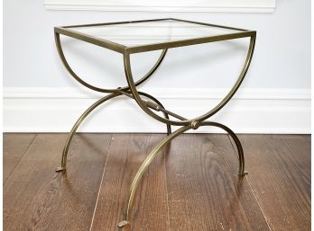 A Modern Brass And Glass Accent Table