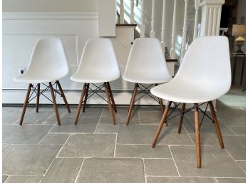 A Set Of 4 Modern Molded Plastic Dining Chairs