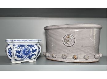 A Pair Of Ceramic Cache Pots