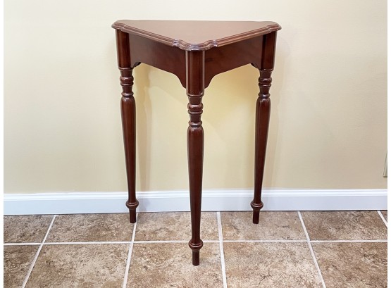 A Cherry Wood Triangle Table