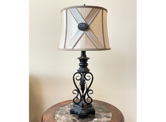 A Wrought Iron Accent Lamp With Custom Silk Shade