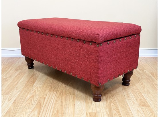 An Upholstered Bench With Nailhead Trim