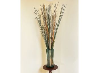 A Glass Vase With Faux Floral