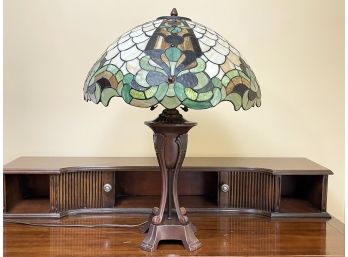 A Tiffany Style Stained Glass Lamp With Bronze Tone Fittings