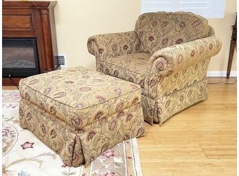 An Upholstered Armchair And Ottoman By Broyhill Furniture
