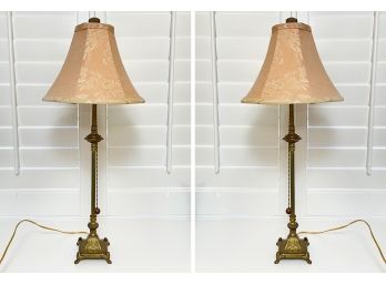 A Pair Of Brass Stick Lamps