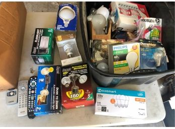 Lot Of New Lighting Related Items - Motion Sensing Floodlights NOS - Several Boxes Of Lightbulbs - TV Remotes