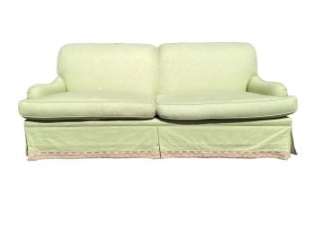 Anne Mahoney Custom Upholstered 2 Cushion Roll Arm Sofa With Decorative Fringed Skirt