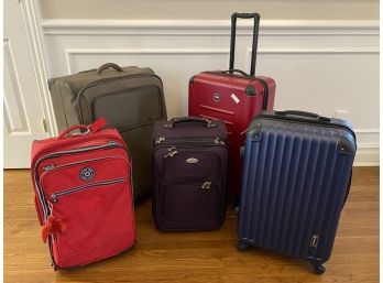 Bundle Of Rolling Travel Suitcases