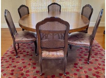 Century Furniture Hardwood Dining Table With Iron Pedestal Base And French Provincial Cane Back Chairs