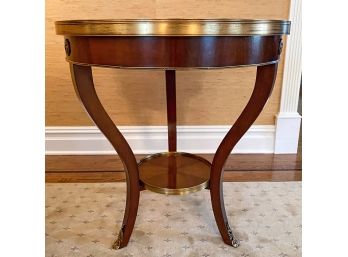Round Accent Table With Antique Brass Medallion Detail And Cabriole Legs