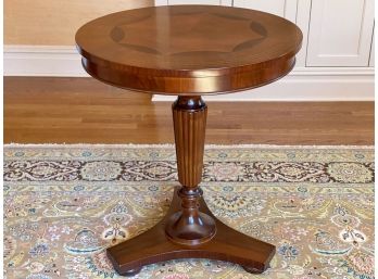 Italian Mahogany Round Pedestal Table With A Fluted Base And Decorative Inlay