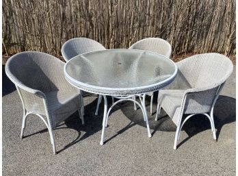White Wicker Outdoor Dining Set With A Pebbled Glass Top Table And 4 Barrel Style Chairs