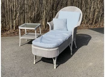White Wicker Barrel Style Chaise Lounge Chair With Custom Cushions And Matching Glass Top Side Table