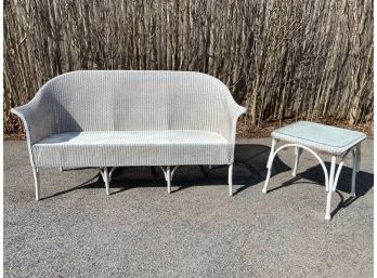 White Wicker Barrel Style Outdoor Sofa And Glass Top Side Table