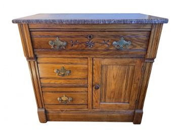 Antique Mahogany Marble Top Buffet Cabinet With Carved Floral Swag Design And Brass Plate Drawer Pulls