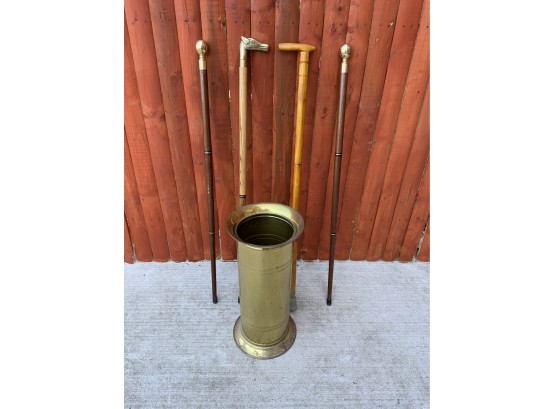 Four Vintage Walking Sticks In A Brass Stand