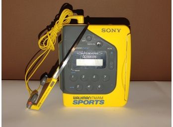 Yellow Sony Walkman AM/FM Sports With Head Phones