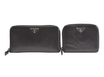 Two PRADA Black Zip Around Leather Wallets