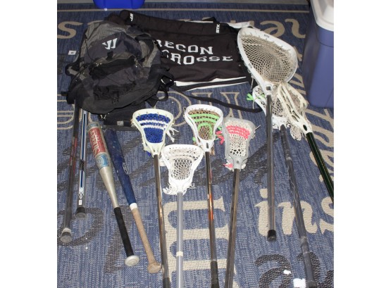 Collection Of Lacrosse Sticks, Two Bats, And A Carrying Bag