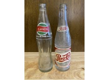 A Pair Of Vintage Soda Bottles