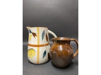 A Pretty Pair Of Pottery Pitchers