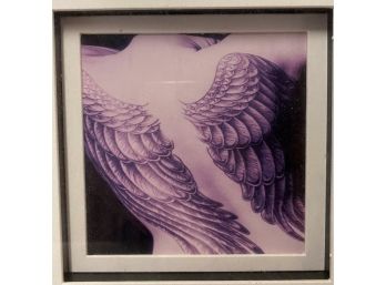 Artistic Photograph Of Woman's Wing-Tattooed Back