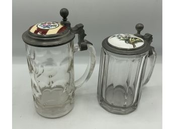 2 Glass Lidded Steins With Enamel Tops