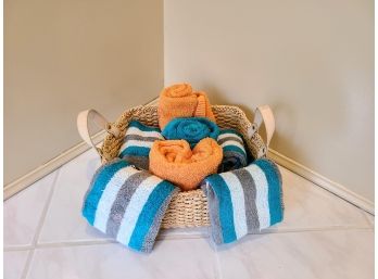 Braided And Woven Basket With Colorful Towel Assortment