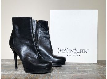 A Pair Of High Heeled Boots By Yves Saint Laurent