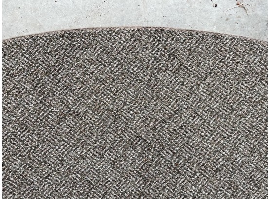 A Large Round Woven Indoor/Outdoor Carpet