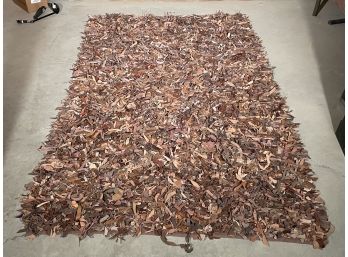 A Leather Rag Rug In Nutty Tones