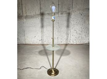 A Brass Standing Lamp With Glass Cocktail Table Combo