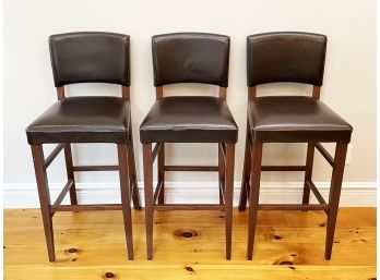 A Trio Of Leather Bar Stools
