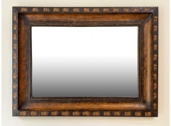 A Large Patinated Tin Framed Beveled Mirror