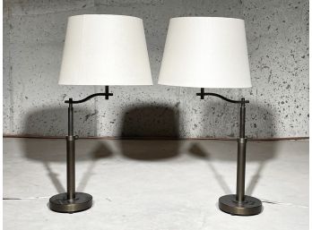 A Pair Of Modern Bronze Adjustable Height Stick Lamps