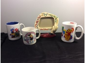 3 Disney Coffee Mugs And A Disney Collectible Picture Frame