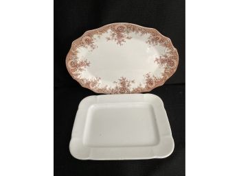One White Platter And One Oval Platter With Floral Pattern