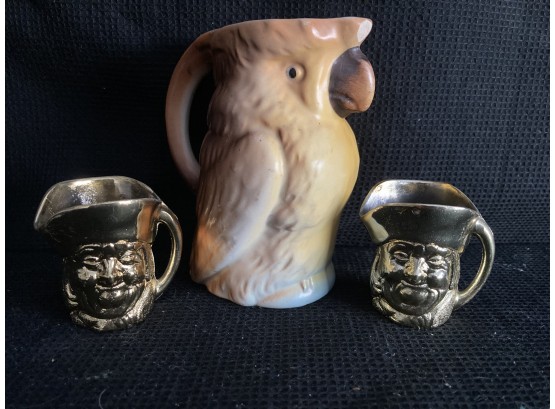 A Parrot Mini Pitcher And Two Mini Pirate Pitchers