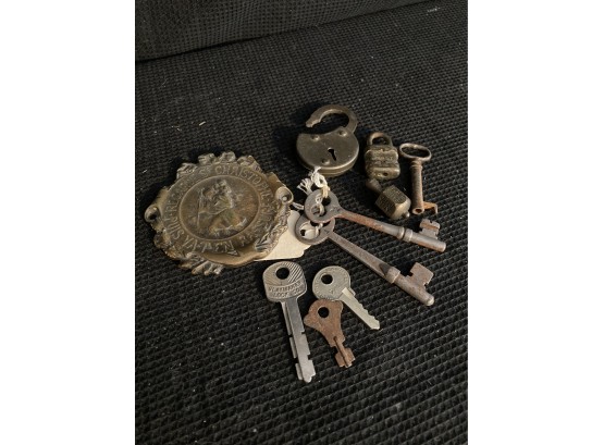 Lock, Keys, And A Metal Badge