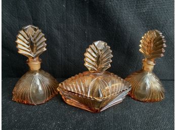 Three Amber Colored Glass Bottles