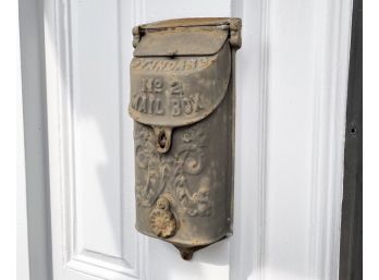 An Antique Cast Iron Letterbox