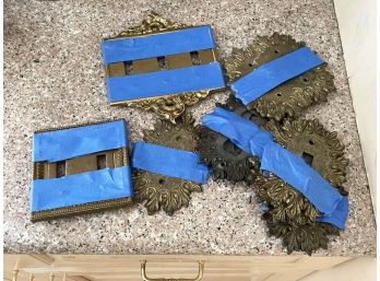 An Assortment Of Vintage Brass Switchplate Covers
