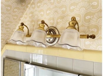 A Brass And Glass Vanity Fixture