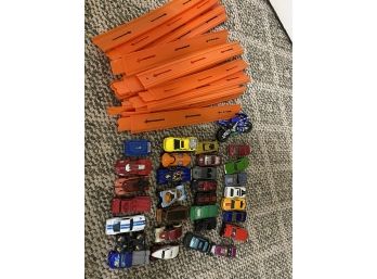 Collection Of Diecast Vehicles And Tracks